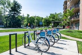Cherry Hill apartment for rent - a row of bikes parked in a bike rack outside of an apartment building