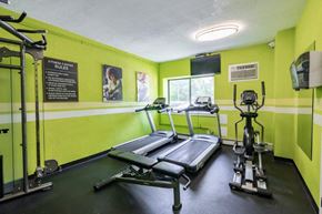 Cherry Hill apartment for rent - a gym with weights and a tv in it