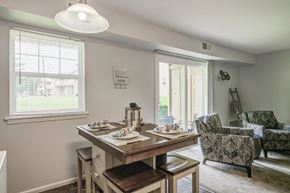 Eastampton apartment for rent - a dining room with a table and chairs