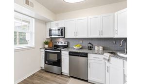 Eastampton apartment for rent - A kitchen with white cabinets and stainless steel appliances.