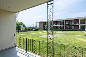 Long Branch apartment for rent - the view of a yard from the balcony of an apartment building