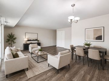 Blackwood apartment for rent - A modern living room with a large couch, a coffee table, and a dining table set up.