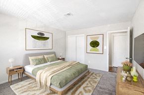 Blackwood apartment for rent - a bedroom with a bed and pictures on the wall