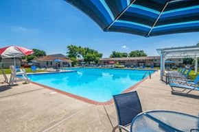 Blackwood apartment for rent - our resort style swimming pool is open to the community and has lounge chairs and tables