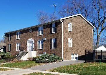 Elgin, Il apartment for rent - a brick house with a sidewalk in front of it