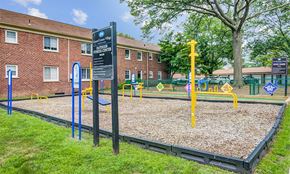 Springfield apartment for rent - a playground at a school with a sign in front of it
