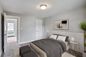 Springfield apartment for rent - a bedroom with a bed and a door into a room