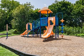Long Branch apartment for rent - a playground with a blue and orange swing set