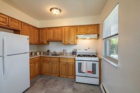 Long Branch apartment for rent - a kitchen with a stove and a refrigerator
