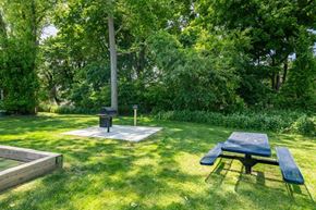 Long Branch apartment for rent - a picnic area with a picnic table and a grill