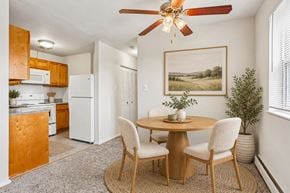 Bellmawr apartment for rent - A dining room with a round table and chairs.