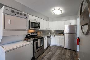 Middletown apartment for rent - a kitchen with stainless steel appliances and white cabinets