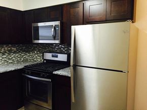 Eatontown apartment for rent - a kitchen with a stainless steel refrigerator and a stove