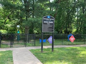 Eatontown apartment for rent - a dog park with a sign in the grass