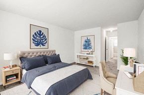 Eatontown apartment for rent - a bedroom with a bed and two paintings on the wall
