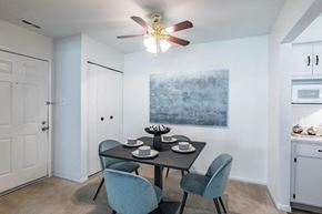 Absecon apartment for rent - a dining room with a table and chairs and a ceiling fan
