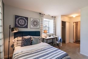 Absecon apartment for rent - a bedroom with a bed and a desk and a window