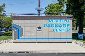 Cherry Hill apartment for rent - a sign for theresident package center on the side of a building
