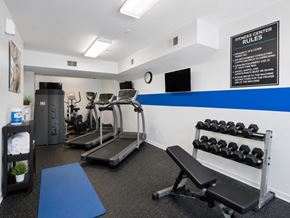 Annandale townhouse for rent - A gym with a sign that says "Fitness Center Rules".