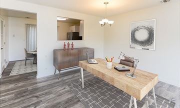 Annandale townhouse for rent - a living room with a wooden desk and a dining room table