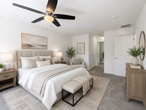 Annandale townhouse for rent - A bedroom with a large bed and a ceiling fan.