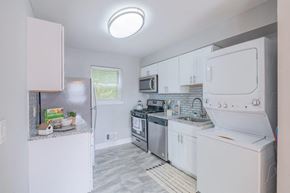Mt. Arlington apartment for rent - a white kitchen with white appliances and white cabinets