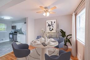 Mt. Arlington apartment for rent - a dining room with a table and chairs and a ceiling fan