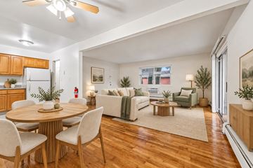 Mt. Arlington apartment for rent - A well-lit, spacious living room with a dining table and chairs.