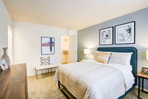 Marlton apartment for rent - a bedroom with a bed and a chair and a window