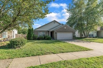 Louisville house for rent - the front of a house with a lawn and trees