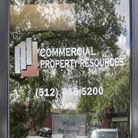 Round Rock apartment for rent - a window with a sign for commercial property resources