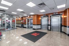 New Brunswick apartment for rent - a lobby with elevators and doors in a building
