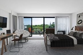 New Brunswick apartment for rent - a bedroom with a bed and a desk and a window