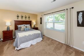 Eastampton apartment for rent - a bedroom with a bed and a large window