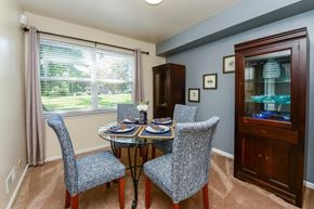 Eastampton apartment for rent - a dining room with a table and chairs and a window