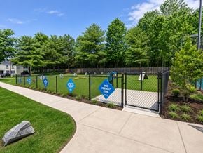 Clementon apartment for rent - A fenced area with signs that say "Frequently Used" and "Playground".