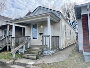 New Albany house for rent - A small house with a porch and a mailbox on the front door.