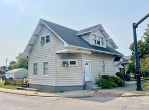 New Albany apartment for rent - A two-story house with a white door and a small porch.