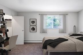 Somerdale apartment for rent - a bedroom with a bed and a desk and a window