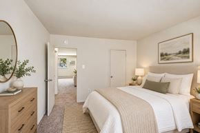 Somerdale apartment for rent - A bedroom with a large bed and a painting on the wall.