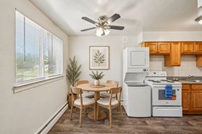 Somerdale apartment for rent - A kitchen with a table and chairs in front of a window.