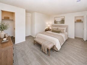 West Deptford apartment for rent - A bedroom with a large bed and a wooden dresser.