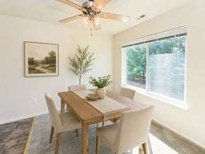 West Deptford apartment for rent - A dining room with a wooden table and chairs.