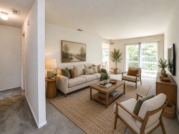 West Deptford apartment for rent - A living room with a couch, chair, and a painting on the wall.