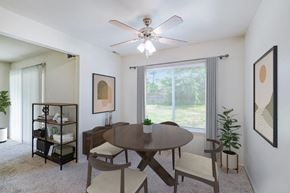 West Deptford apartment for rent - a dining room with a large window and a ceiling fan