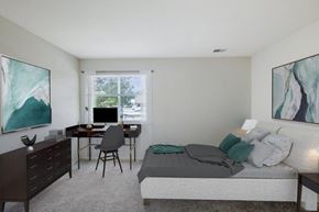 West Deptford apartment for rent - a bedroom with a bed and a desk with a computer