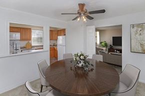 Claymont apartment for rent - a dining room with a table and a ceiling fan