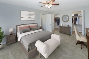 Claymont apartment for rent - a bedroom with a bed and a closet