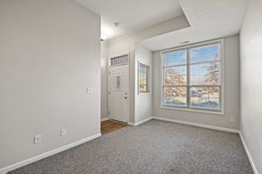 New Albany apartment for rent - a living room with a large window and a door