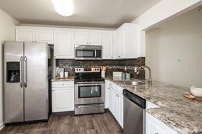 King Of Prussia apartment for rent - kichen with modern white cabinets, stainless steel appliances, and granite countertops